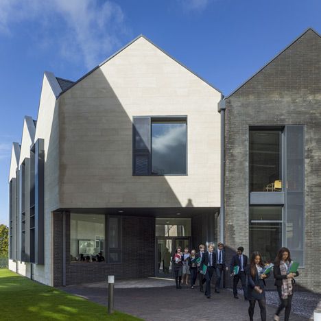 School building by Mitchell Taylor Workshop contrasts pale stone with grey brick