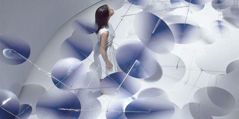 Moving plastic petals balanced in Interconnection installation by Nao Tamura