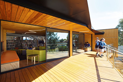 Timber-clad school library extended into the tree tops by Branch Studio Architects