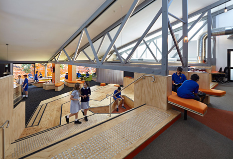 Timber-clad school library extended into the tree tops by Branch Studio Architects