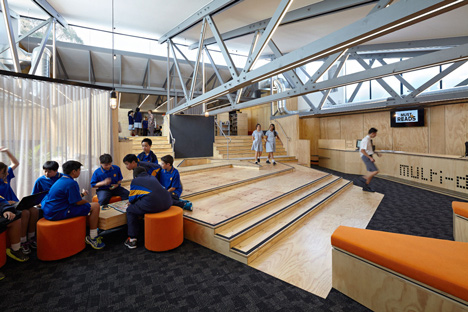 Timber-clad school library extended into the tree tops by Branch Studio Architects