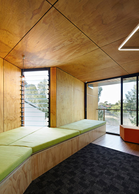 Timber-clad school library extended into the tree tops by Branch Studio Architects