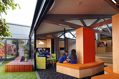 Timber-clad school library extended into the tree tops by Branch Studio Architects