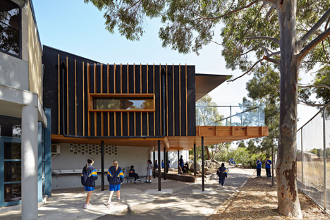 Timber-clad school library extended into the tree tops by Branch Studio Architects