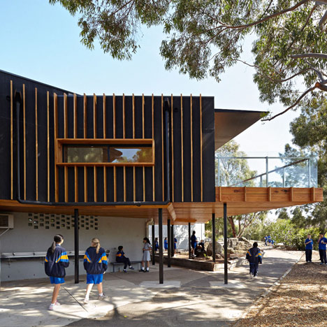 Timber-clad school library extended into the tree tops by Branch Studio Architects