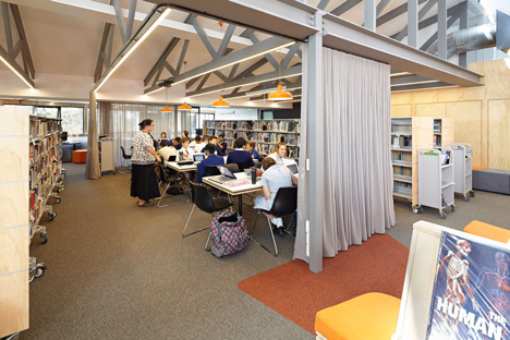 Timber-clad school library extended into the tree tops by Branch Studio Architects