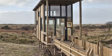 Timber viewing cabin by TYIN Tegnestue overlooks a wild Norwegian landscape