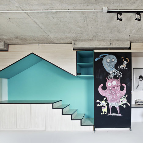 Photography studio by Input Creative Studio features a turquoise playhouse