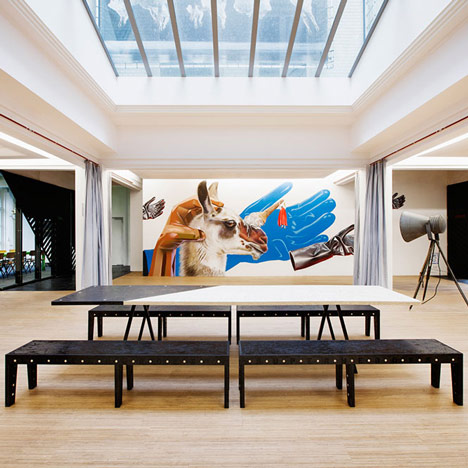 Simon Bush-King adds chipboard furniture and wall art to Superheroes’ office