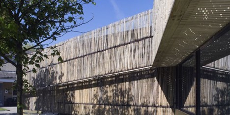 Möhn + Bouman Architects uses wooden fencing to update care centre facade