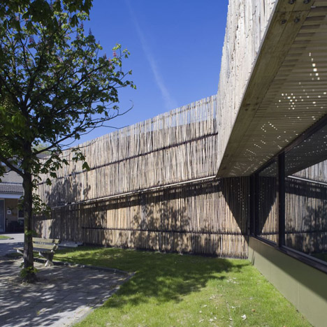Möhn + Bouman Architects uses wooden fencing to update care centre facade