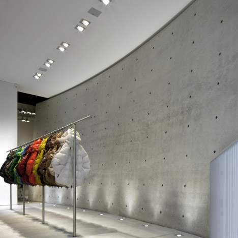 Tadao Ando divides Duvetica store with curved concrete wall