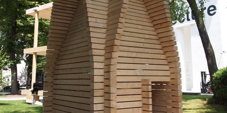 Wooden huts demonstrate regional building techniques at the Finnish Pavilion