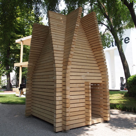 Wooden huts demonstrate regional building techniques at the Finnish Pavilion