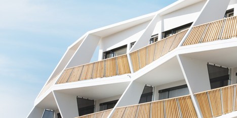 Zigzagging balconies create sculptural facade for Ragnitzstrasse 36 apartment block