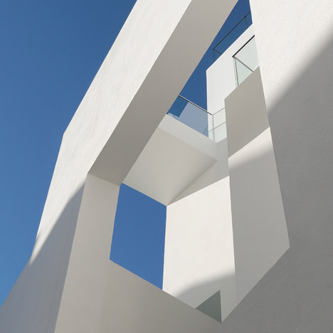 Balconies sit within angular openings at Atelier Zafari's Berlin apartment block