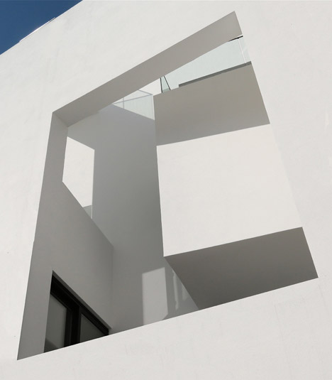 Balconies sit within angular openings at Atelier Zafari's Berlin apartment block