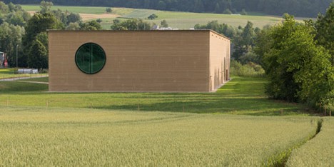 Herzog & de Meuron uses rammed earth to create countryside herb centre for Ricola