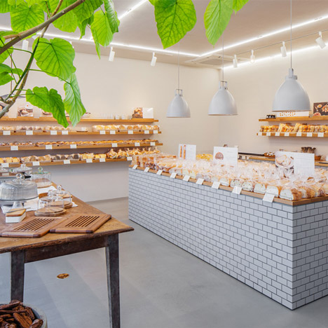 Style Bakery by SNARK features tiled walls and oak shelving