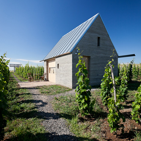 Earthy cabins hide amongst the vineyards at the Almagyar Wine Terrace in Hungary by by Péter Gereben and Balázs Marián