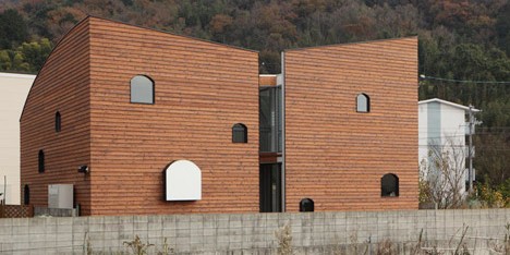 Multi-layered home by Y+M Design Office hides a house-shaped room behind wooden walls