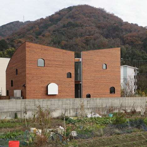 Multi-layered home by Y+M Design Office hides a house-shaped room behind wooden walls