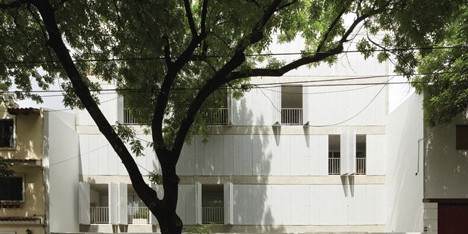 Perforated shutters fold back to reveal apartments at Sucre 4444 by Esteban-Tannenbaum