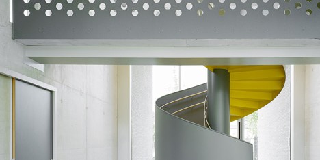 Kindergarten by Ecker Architekten features an austere colour palette and a spiral staircase
