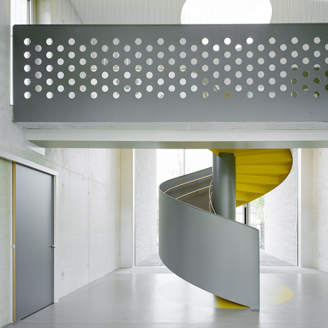 Kindergarten by Ecker Architekten features an austere colour palette and a spiral staircase