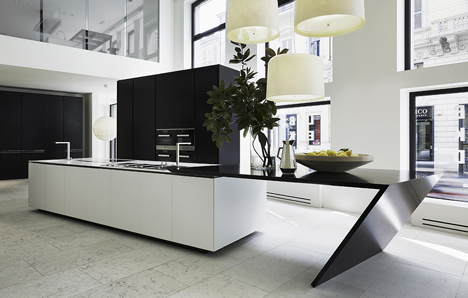 The Sharp kitchen of Poliform Varenna designed by Daniel Libeskind, uses DuPont Corian high-tech surface in the Glacier White colour for the worktop and the sink. The Sharp kitchen of Poliform Varenna designed by Daniel Libeskind, uses DuPont Corian high-tech surface in the Glacier White colour for the worktop and the sink.