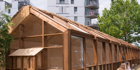 Guinée*Potin Architectes creates “footcheball” playground inside a thatched shed