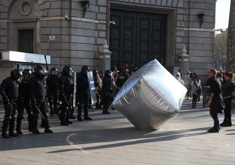 This image: Inflatable cobblestone, action of Eclectic Electric Collective in co-operation with Enmedio collective during the General Strike in Barcelona – main image: two of the three posters by Barnbrook Studio
