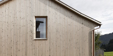 Strips of local spruce clad Haus Feurstein by Innauer‐Matt Architekten