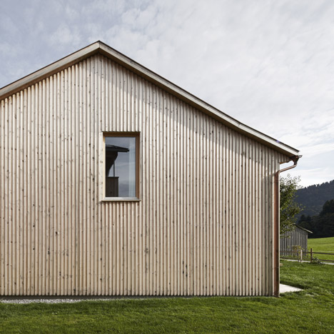 Strips of local spruce clad Haus Feurstein by Innauer‐Matt Architekten