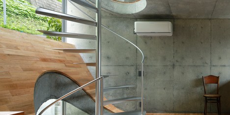 Spiral stairs puncture hilly floors inside Takeshi Hosaka’s House in Byobugaura