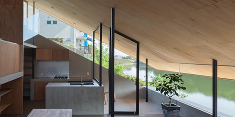Suppose Design Office’s ￼House in Hibaru stretches down to the edge of a reservoir