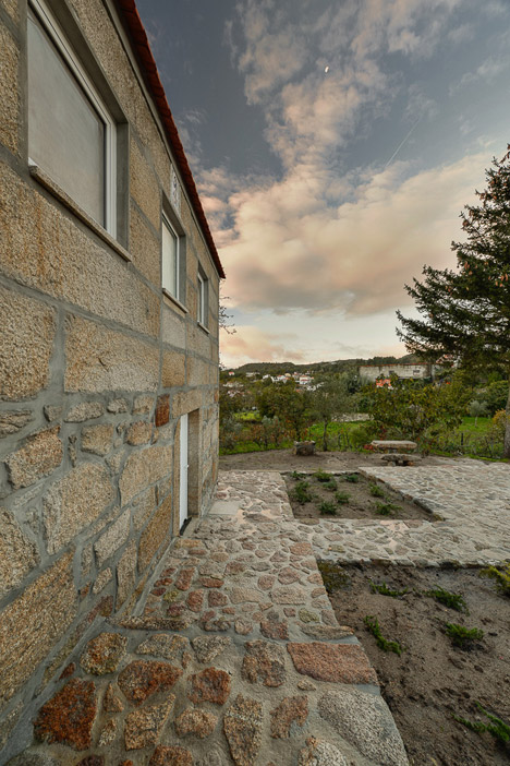 Wood Structure Inside Stone Walls by Corpo Atelier