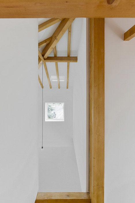 Wood Structure Inside Stone Walls by Corpo Atelier