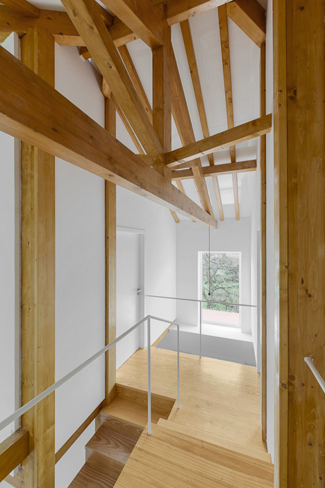 Wood Structure Inside Stone Walls by Corpo Atelier