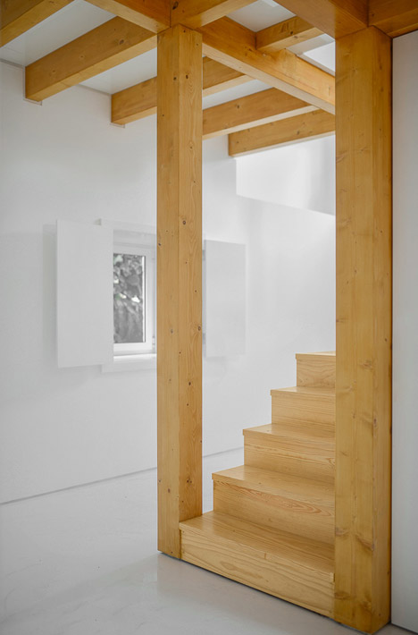 Wood Structure Inside Stone Walls by Corpo Atelier