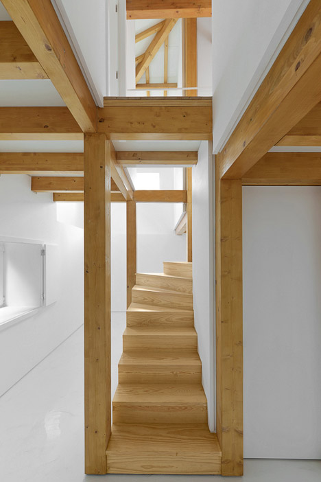 Wood Structure Inside Stone Walls by Corpo Atelier