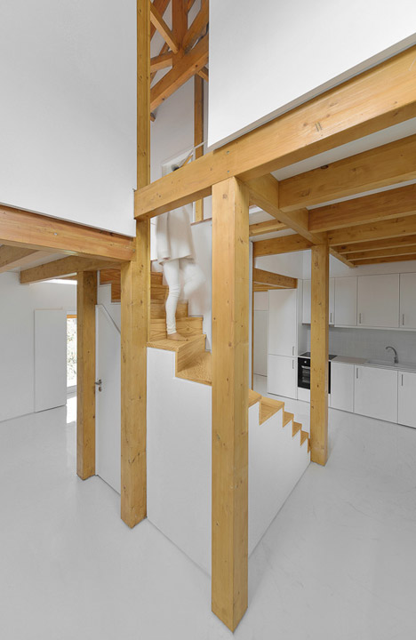 Wood Structure Inside Stone Walls by Corpo Atelier