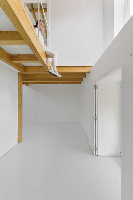 Wood Structure Inside Stone Walls by Corpo Atelier