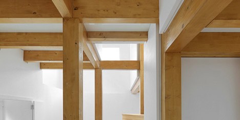 Wood Structure Inside Stone Walls by Corpo Atelier