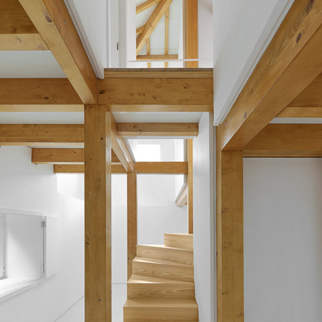 Wood Structure Inside Stone Walls by Corpo Atelier