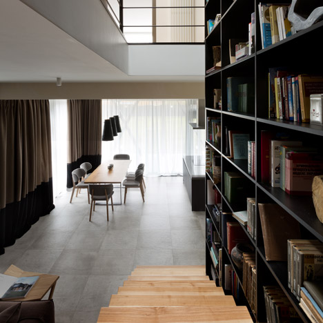 Ukraine house by Sergey Makhno combines a staircase with a two-storey-high bookcase
