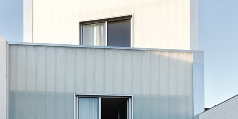 Rue Space’s Casa #20 features a four-tiered facade of translucent glass
