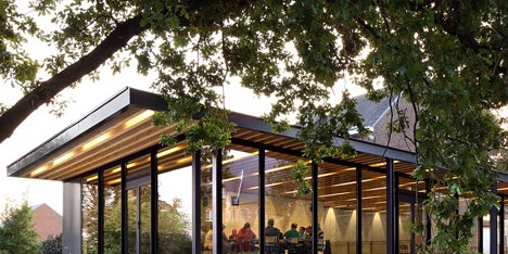 Glazed pavilions form a community centre in the grounds of an old Flemish manse