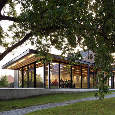 Glazed pavilions form a community centre in the grounds of an old Flemish manse
