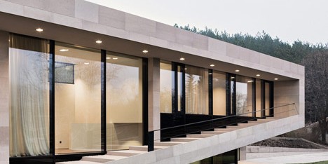 Stone house in Bulgaria by I/O Architects features a veranda that steps up and down